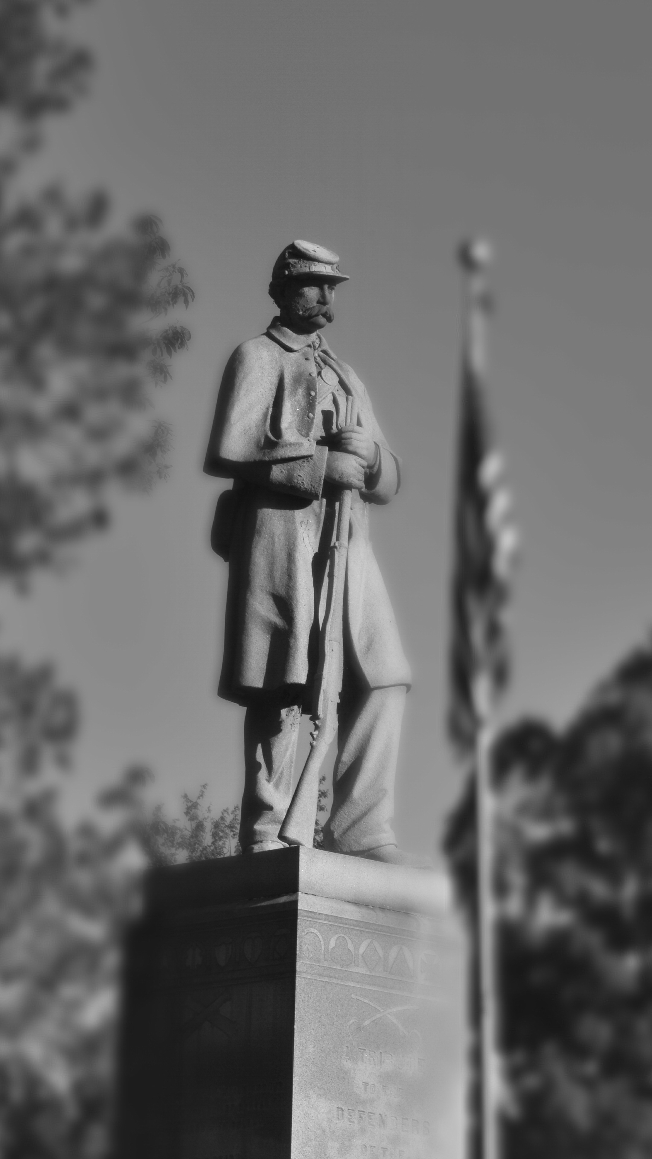 Black-and-white photo of a Civil War soldier statue at Wildwood Cemetery